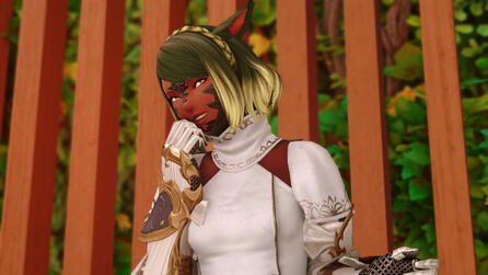 Vera is standing and laughing while looking at the camera.